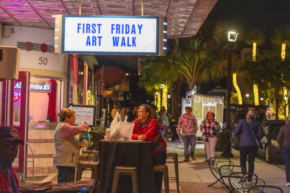 Despite the chilly weather, visitors and artists flocked to downtown Ocala for the First Friday Art Walk, enjoying drinks at the Marion Theatre.