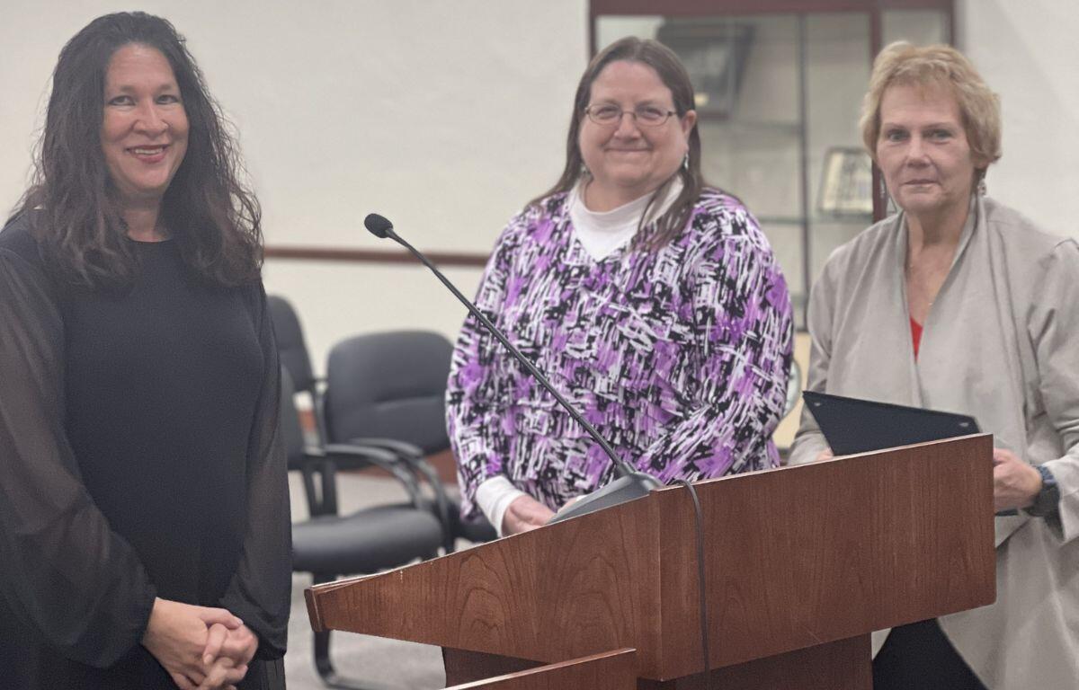 Belleview Mayor Christine Dobkowski (left) accepts the award alongside Belleview CFO Marge Strausbaugh (right) and Deputy Finance Director Donna Morse (middle).