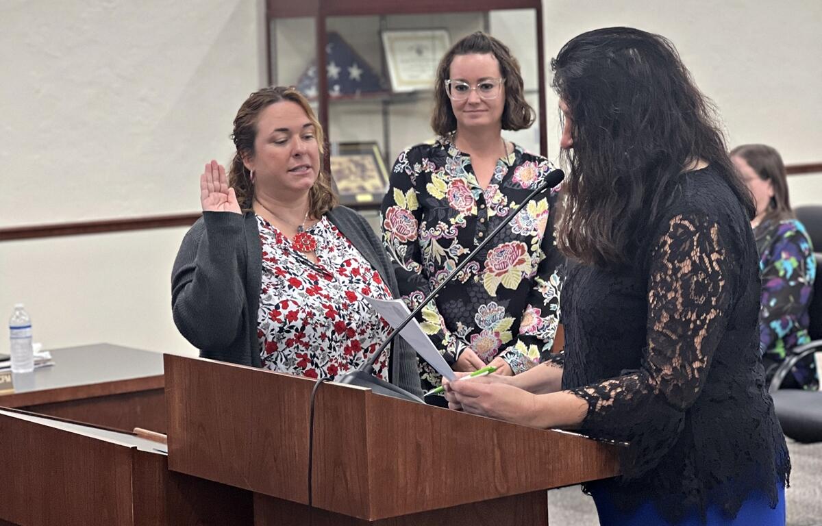 Mariah Moody, newly appointed Belleview City Administrator, and Lezli Merritt, newly sworn-in City Clerk, stand together at City Hall. Moody will oversee city operations and strategic planning, while Merritt manages public records and meetings to ensure government transparency.