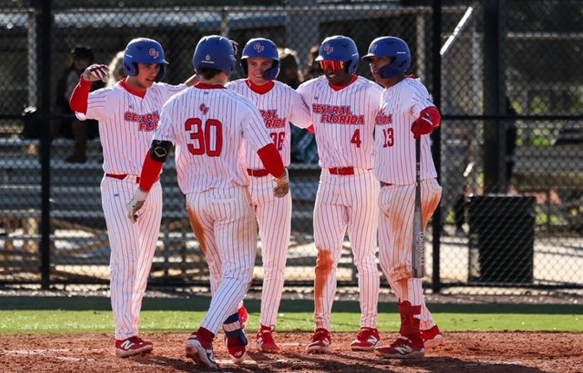 Dawson Harman celebrates with teammates after scoring the game-winning run in CF's thrilling 13-12 walk-off victory over South Florida State College.