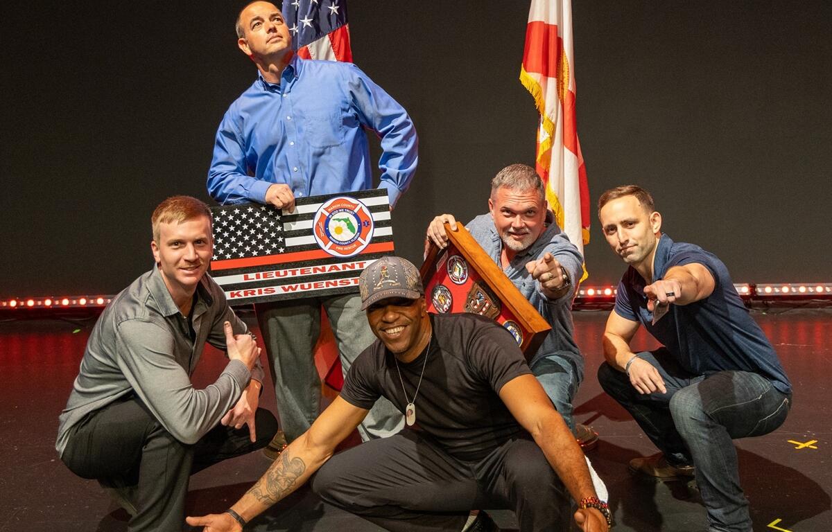 Lt. Kris Wuenstel shares a lighthearted moment with coworkers during his retirement celebration on Jan. 30, 2025. The longtime firefighter and paramedic served Marion County Fire Rescue for 26 years.