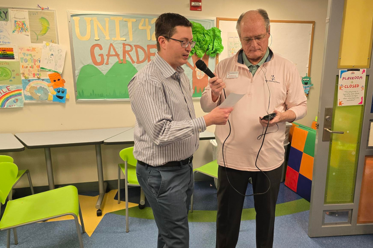 Dr. John Ligon, left, records a radio interview with Jim Robertson of Stop Children's Cancer to discuss the upcoming Bear-A-Thon fundraiser, Feb. 12, on 93.7 K-Country and 92.5/95.5 Wind-FM.