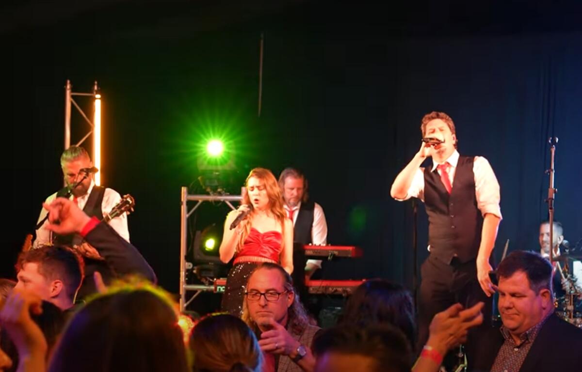 Guests celebrate in style at the World of Red Party, an elegant evening of fashion, entertainment, and philanthropy.