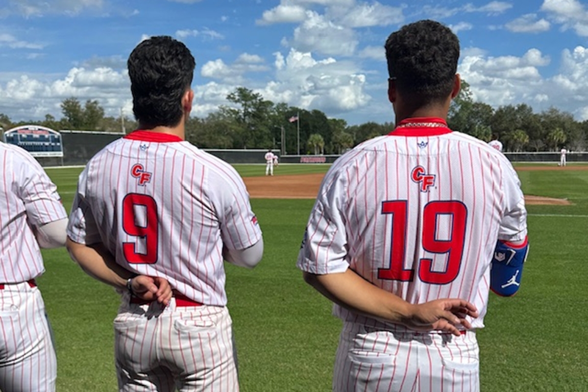 Players from the College of Central Florida stand for the national anthem before their Citrus Conference opener at Goodlett Field in Ocala, FL, on Thursday, Feb. 15, 2025.