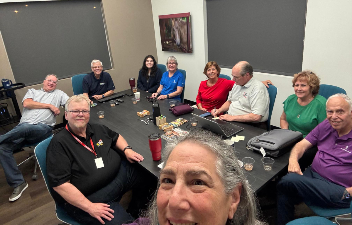 North Central Florida Media Group celebrates the first day of Bear-A-Thon donations with Laurel Freeman (center) and Howard Freeman (far right).