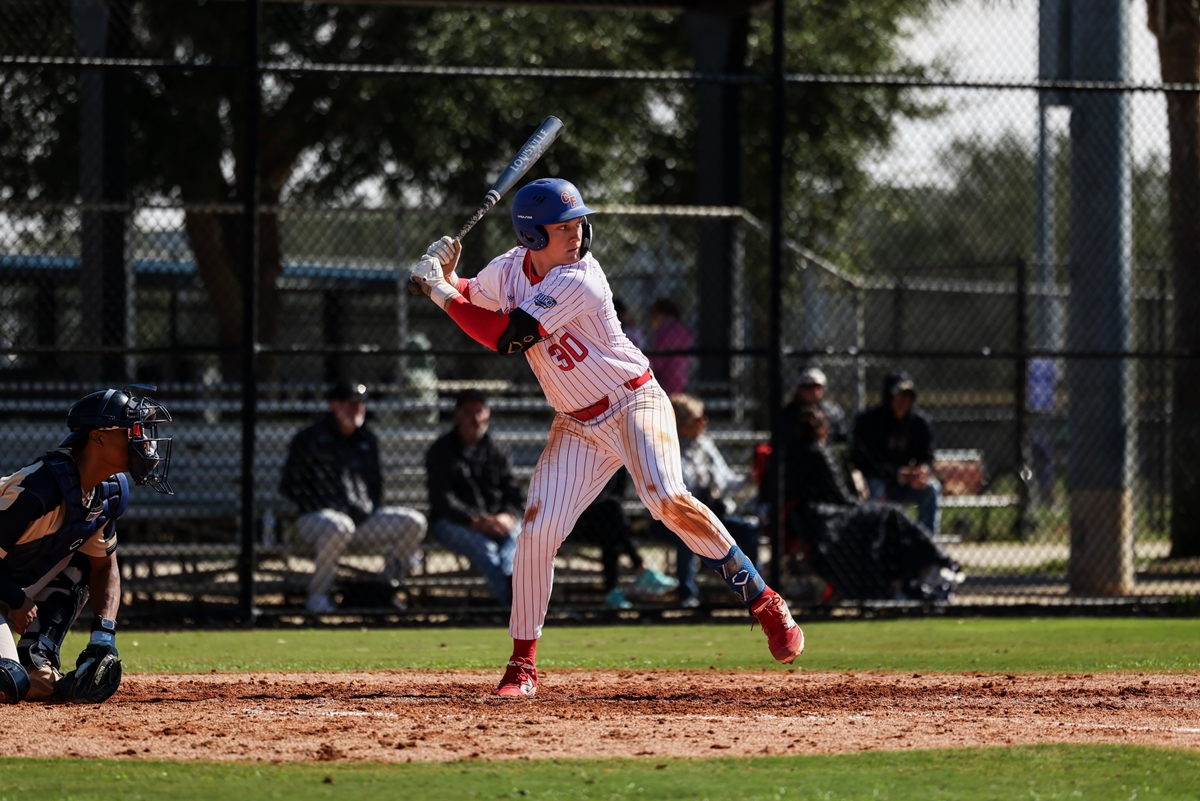 Dawson Harman of the College of Central Florida prepares to swing during a game against Polk State at Goodlett Field in Ocala, Fla., on Saturday. Harman contributed with two doubles, two runs scored, and an RBI in the Patriots’ 9-0 victory.