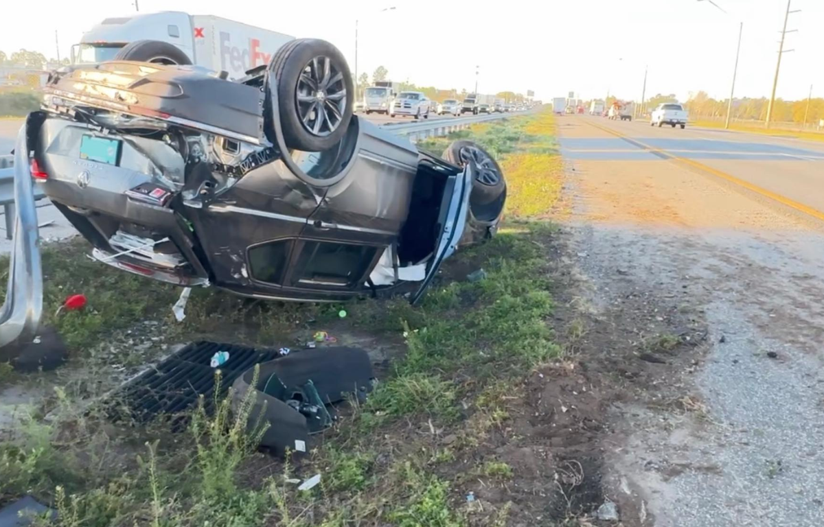 A passenger vehicle rolled over during the accident.