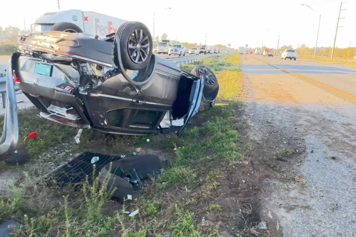 A passenger vehicle rolled over during the accident.