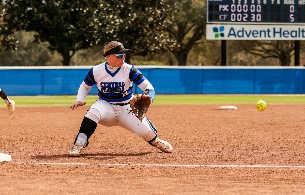 Infielder Caitlin Blankenship prepares to field a ground ball.