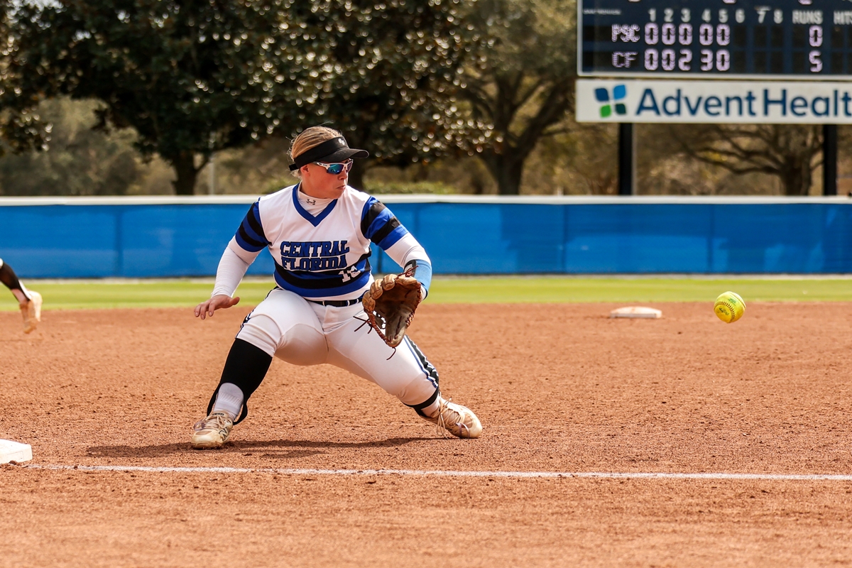 Infielder Caitlin Blankenship prepares to field a ground ball.