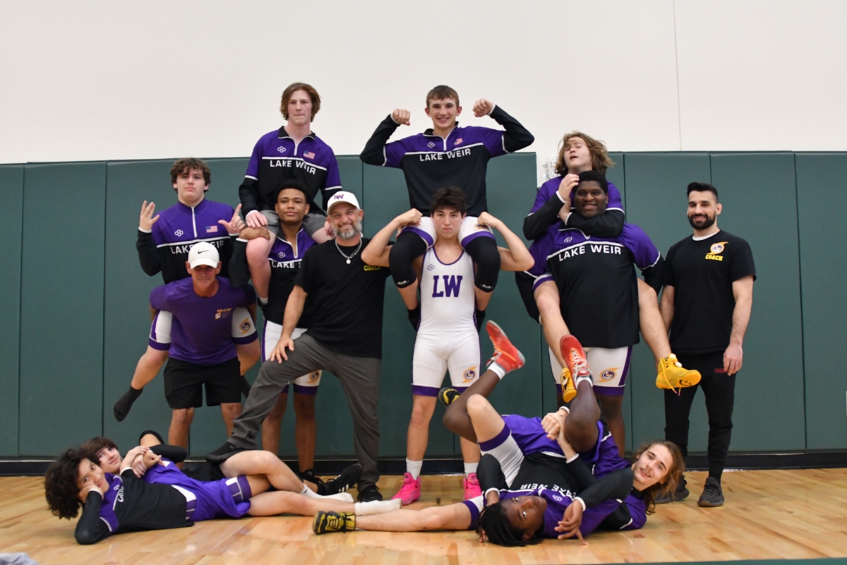 Lake Weir High School wrestlers strike a playful pose after a successful postseason run, including strong finishes at the county and district tournaments. Two athletes advanced to the Florida State Championships in Kissimmee.