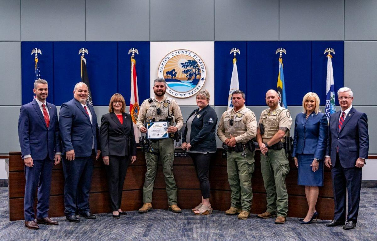 Florida Fish and Wildlife Conservation Commission Officer Wade Constance receives the Litter Hero Award from the Marion County Commission on March 18, 2025, for his investigative work that led to the arrest of an individual responsible for illegally dumping over 5,000 pounds of trash.