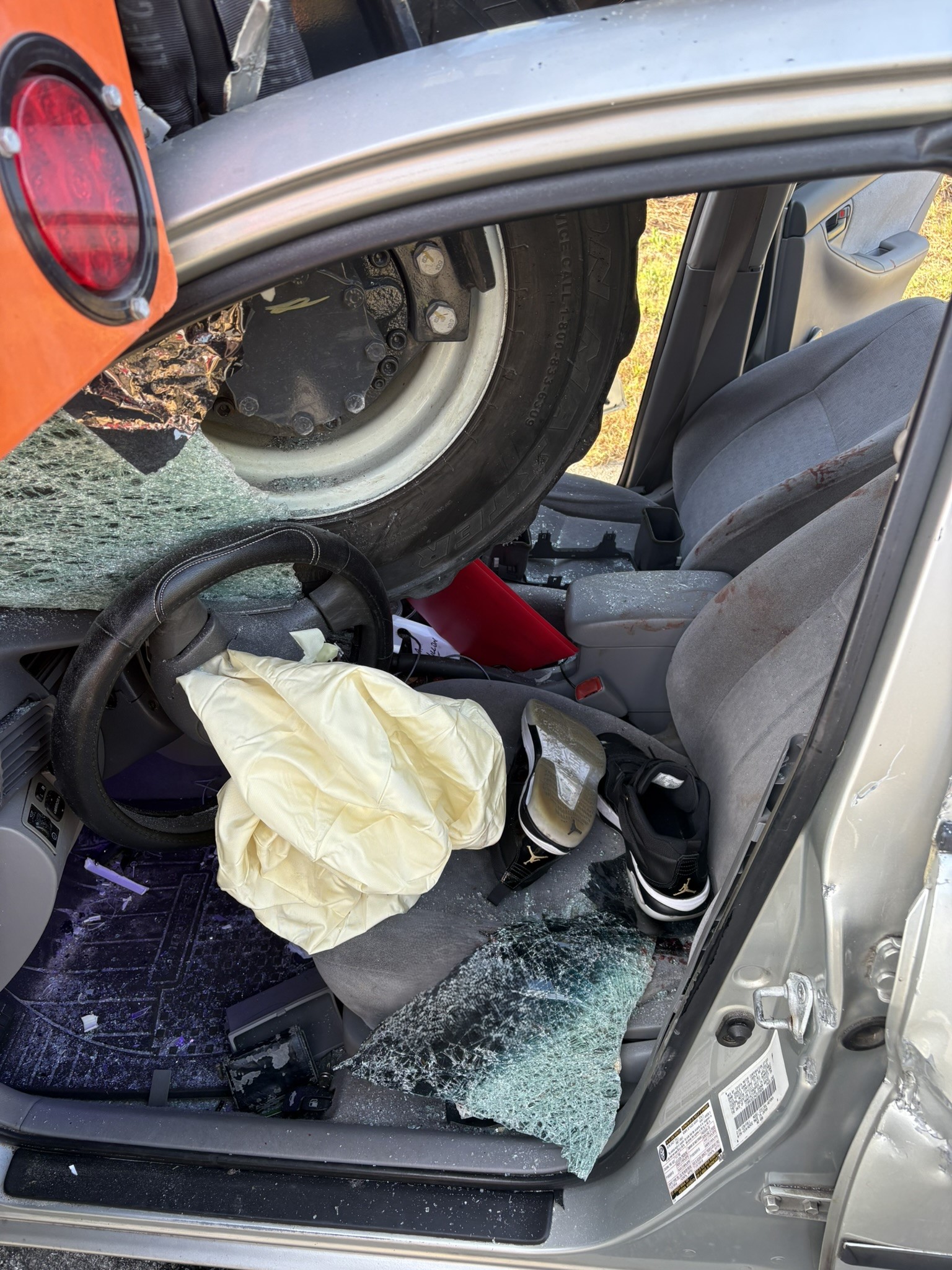 Three people transported to hospital after sedan collides with tractor ...