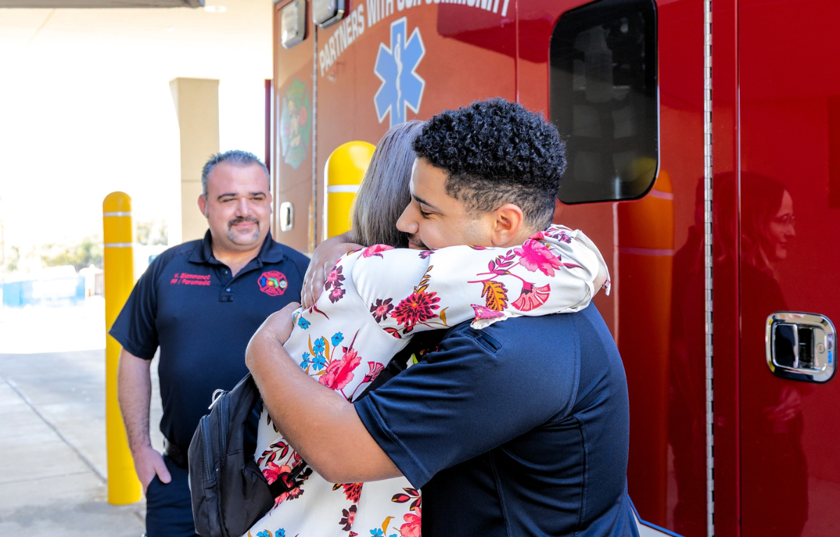 Opel Arroyave embraces a Marion County Fire Rescue worker that helped save her life following a stroke