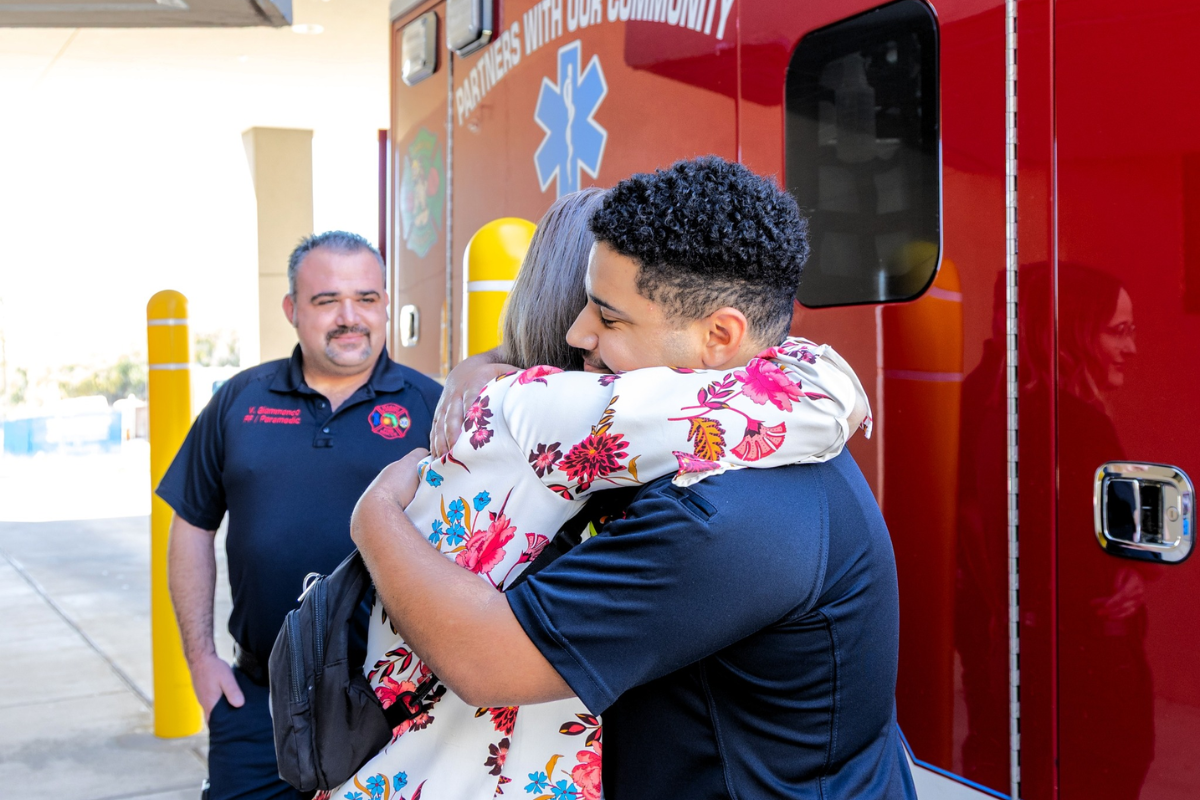 Opel Arroyave embraces a Marion County Fire Rescue worker that helped save her life following a stroke