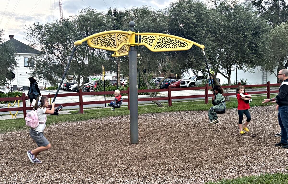 Families enjoy an afternoon at the playground in Downtown Ocala, highlighting the importance of parks and community spaces as Marion County plans for future growth.