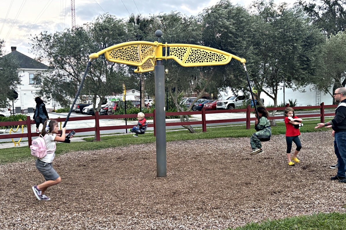 Families enjoy an afternoon at the playground in Downtown Ocala, highlighting the importance of parks and community spaces as Marion County plans for future growth.