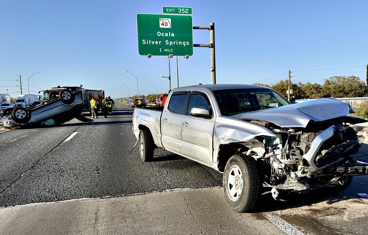 A silver pickup truck with front-end damage sits on I-75 Northbound after a multi-vehicle crash in Ocala on Wednesday. The driver remained inside as emergency crews responded.
