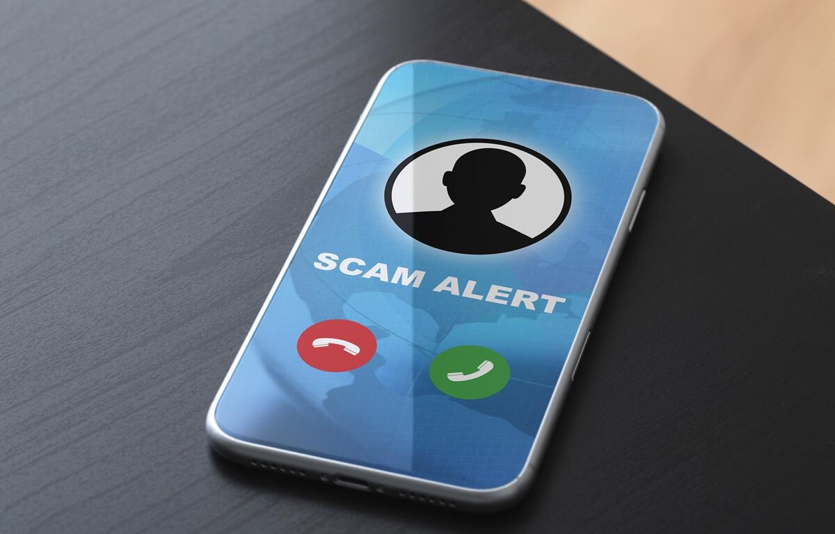 Smartphone screen displaying a “Scam Alert” warning for an incoming fraudulent call.