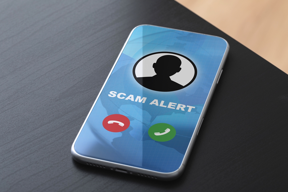 Smartphone screen displaying a “Scam Alert” warning for an incoming fraudulent call.