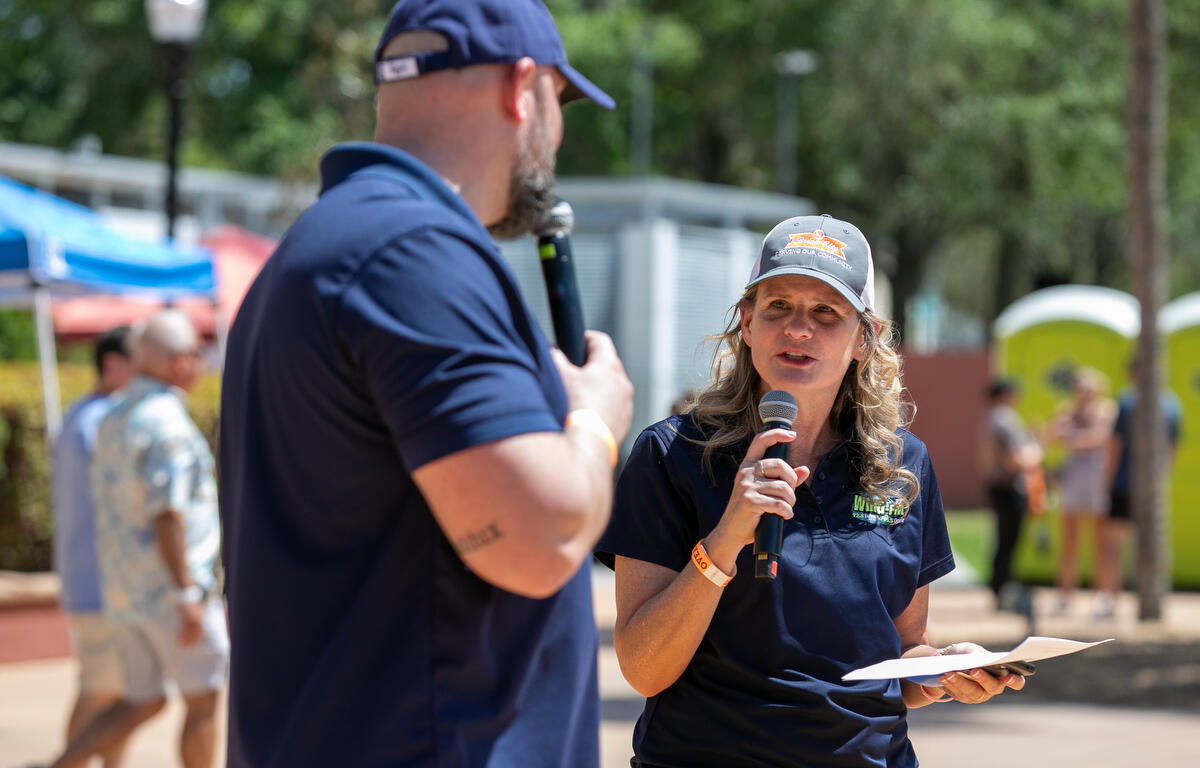 Hunter (right) and Dupree (left) from Wind-FM introduce a band during the 11th Annual Brick City Beer and Wine Festival at Citizen Circle in Ocala, FL on Saturday, April 19, 2025. Courtesy: Alan Youngblood/352today