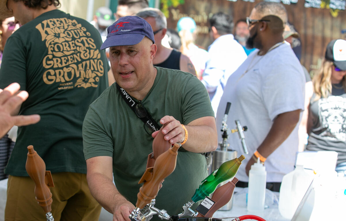 Cliff Kalina from the Ocala Home Brewers club pours a glass during the 11th Annual Brick City Beer and Wine Festival at Citizen Circle in Ocala, FL on Saturday, April 19, 2025. Courtesy: Alan Youngblood/352today