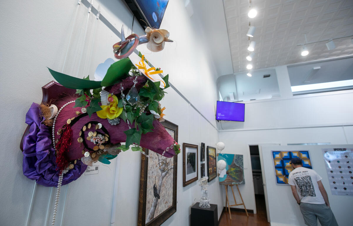 Visitors check out the new exhibit at Brick City Center for the Arts Upcycled Art from Waste to Wonder downtown during First Friday Art Walk in Ocala, FL on Friday, April 4, 2025.