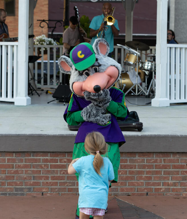 Chuck E Cheese entertains downtown during First Friday Art Walk in Ocala, FL on Friday, April 4, 2025.