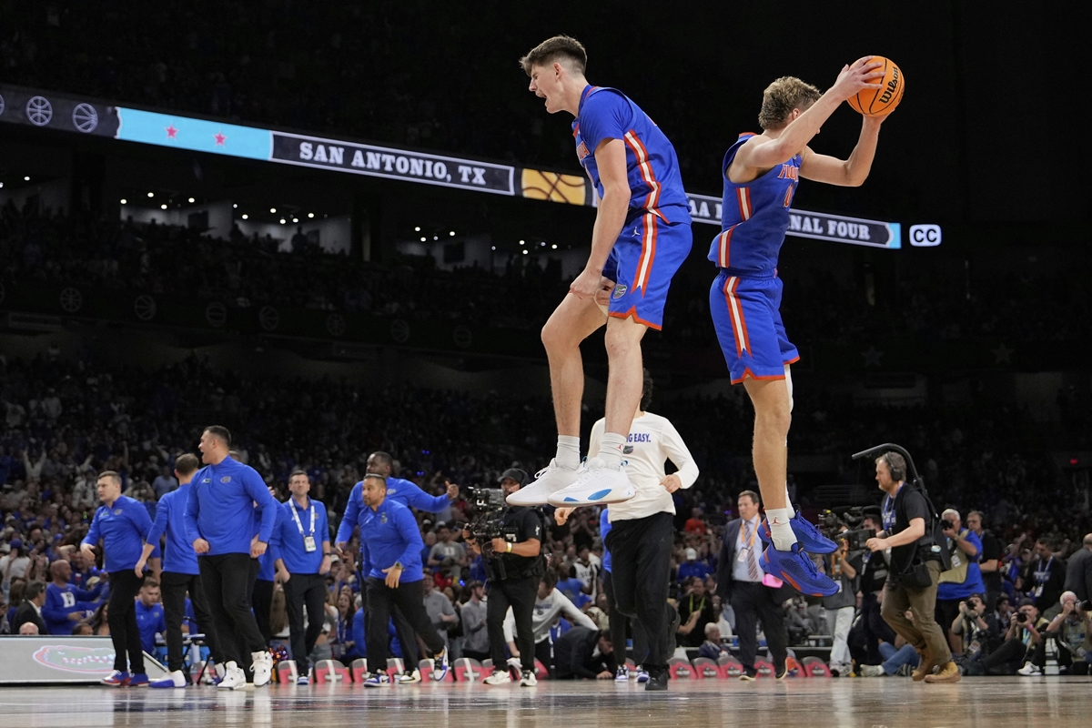 Florida forward Alex Condon and forward Thomas Haugh celebrate their win against Auburn in the national semifinals at the Final Four of the NCAA college basketball tournament, Saturday, April 5, 2025, in San Antonio.