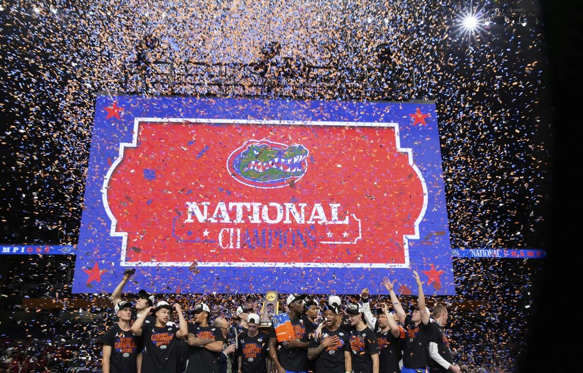 Florida celebrates with the trophy after their win against the Houston in the national championship at the Final Four of the NCAA college basketball tournament, Monday, April 7, 2025, in San Antonio.