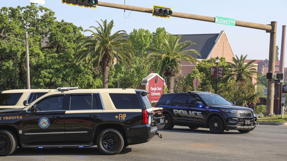 The Florida State Student Union building is seen behind law enforcement vehicles in Tallahassee, Fla., Thursday, April 17, 2025. Courtesy: Gary McCullough/AP Photo