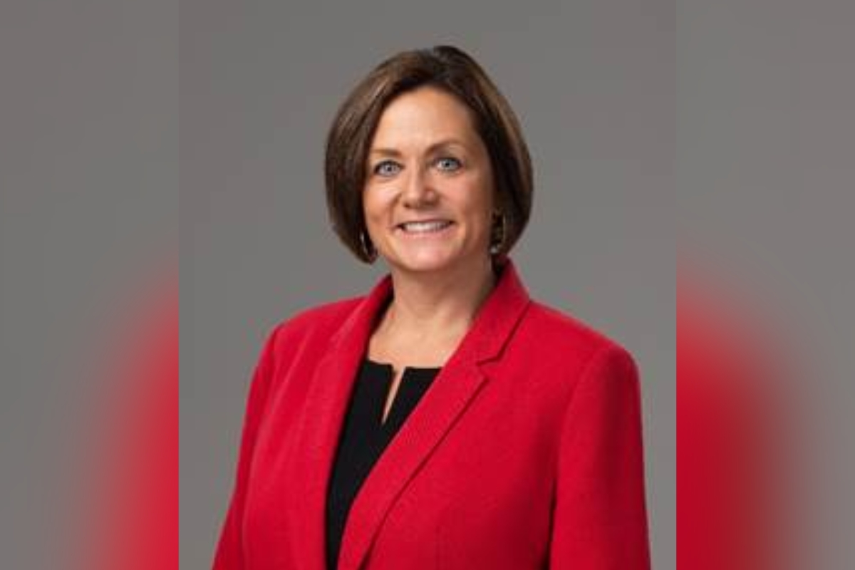 Dr. Danielle Brewer wearing a red blazer and smiling in a professional headshot.