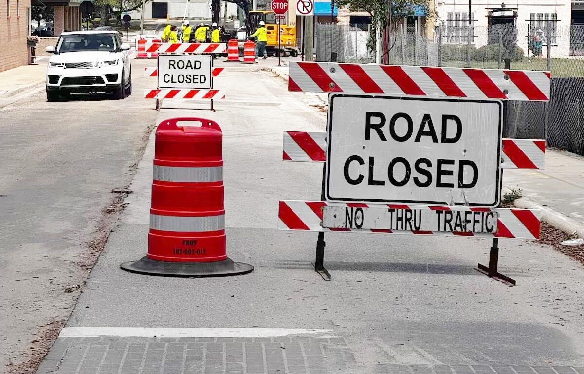 Road closed signs and construction barrels block access along SW 3rd Avenue in downtown Ocala as crews work near the future site of the AC Hotel and parking garage.