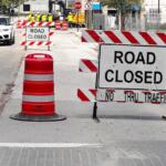 Road closed signs and construction barrels block access along SW 3rd Avenue in downtown Ocala as crews work near the future site of the AC Hotel and parking garage.