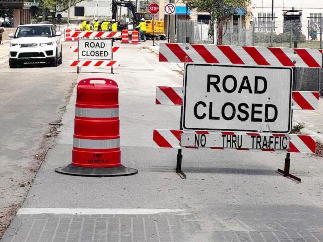 Road closed signs and construction barrels block access along SW 3rd Avenue in downtown Ocala as crews work near the future site of the AC Hotel and parking garage.