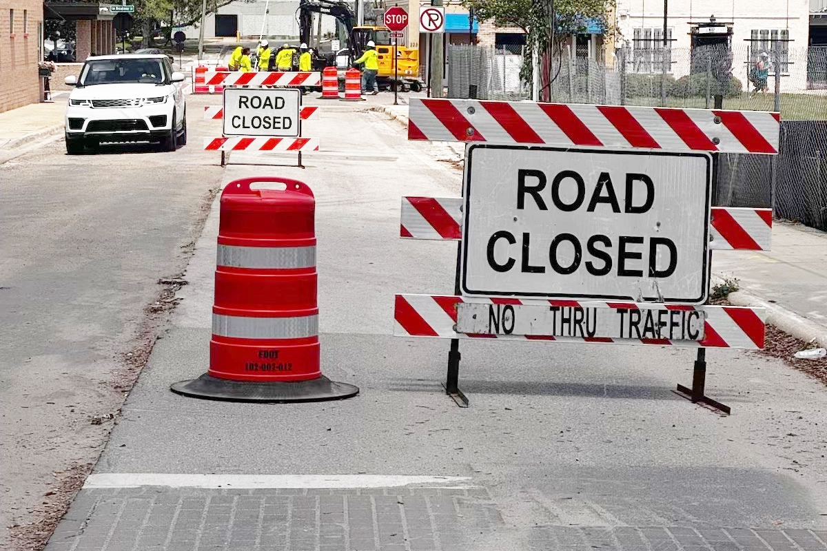 Road closed signs and construction barrels block access along SW 3rd Avenue in downtown Ocala as crews work near the future site of the AC Hotel and parking garage.