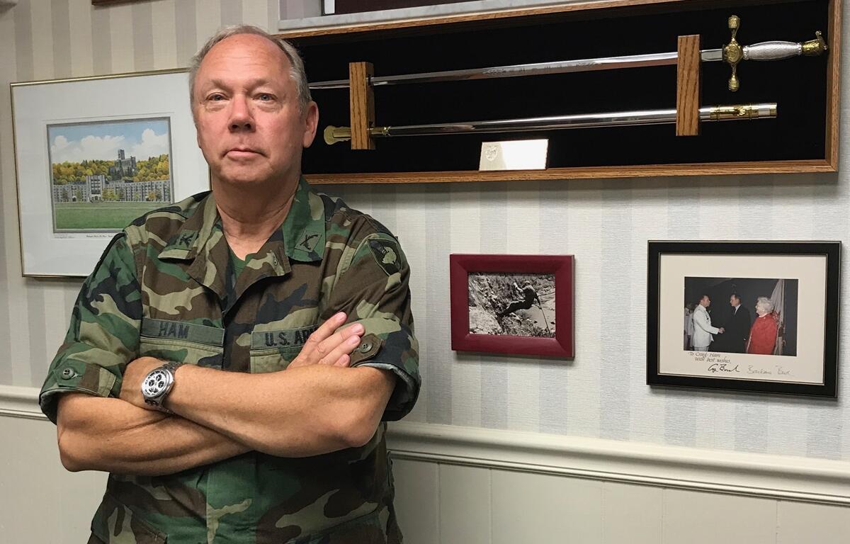 Retired U.S. Army Col. Craig Ham stands in front of a wall of military memorabilia at his Ocala home. Ham has held leadership roles both in the military and as a civilian, including work in education and local nonprofit efforts.