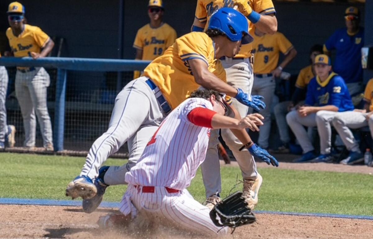 Indian River State College runner collides with College of Central Florida pitcher Karson Lindsey at home plate during Saturday’s game in Ocala. The runner was ruled safe.