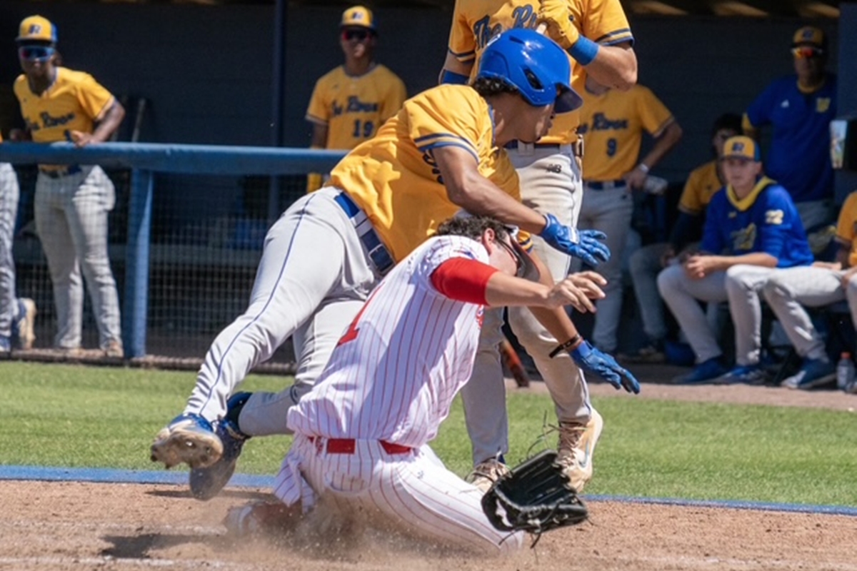 Indian River State College runner collides with College of Central Florida pitcher Karson Lindsey at home plate during Saturday’s game in Ocala. The runner was ruled safe.