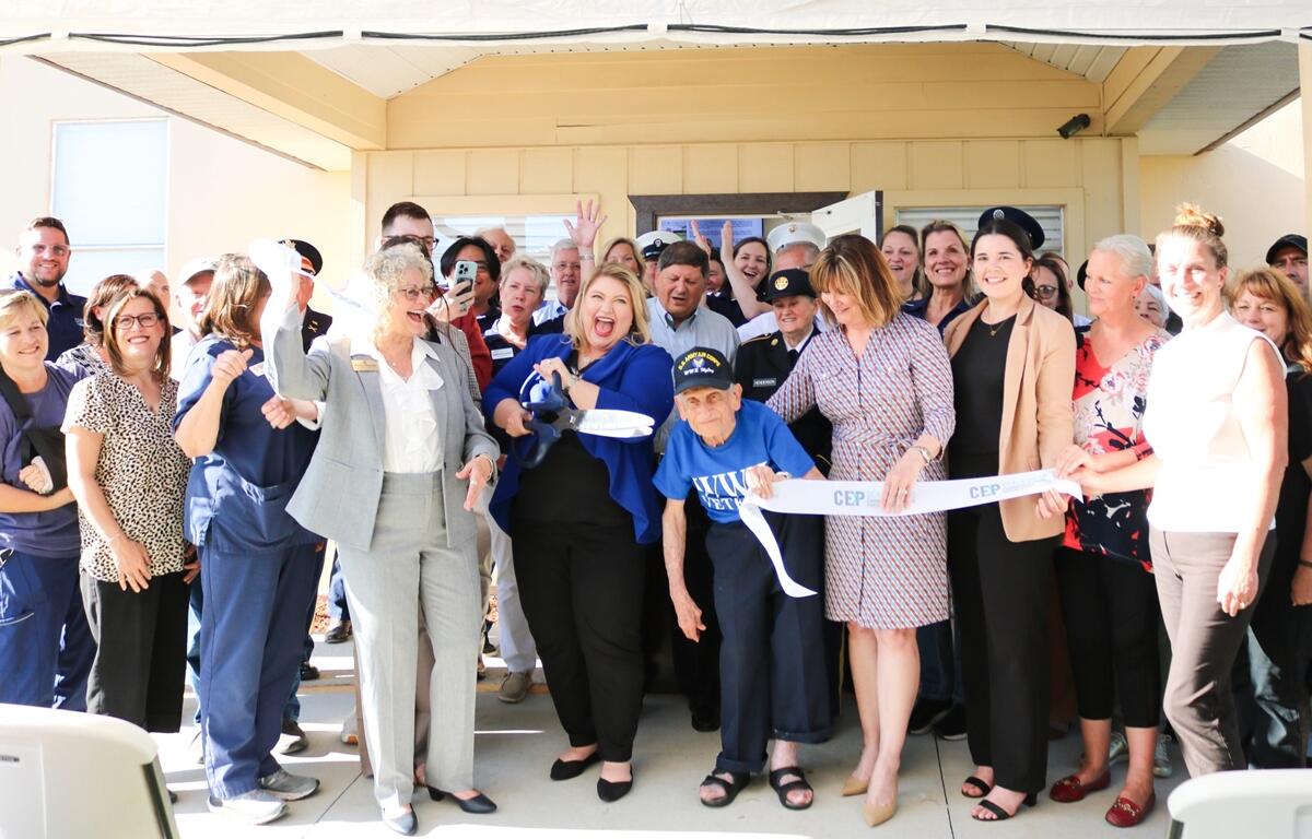 U.S. Rep. Kat Cammack, joined by local officials and veterans, cuts the ribbon during the grand reopening of her Ocala district office at the McPherson Governmental Campus on April 14, 2025.
