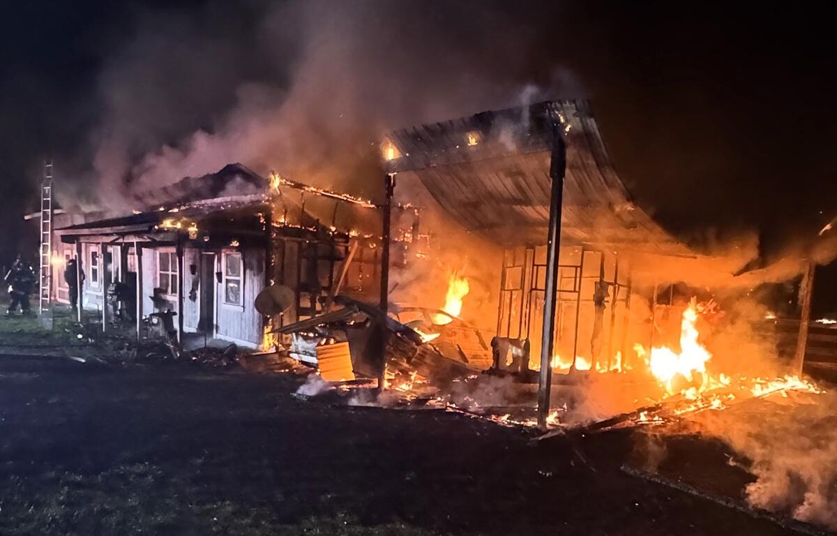 A structure in Summerfield is engulfed in flames late Tuesday night as Marion County Fire Rescue crews work to contain the blaze.