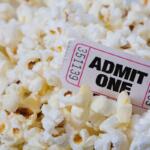 A single Admit One ticket and popcorn