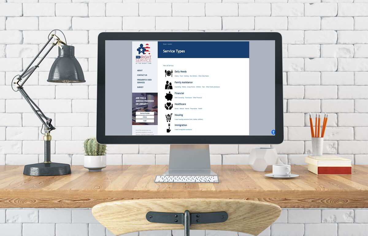 A desktop displays the homepage of “The Right Service at the Right Time,” Marion County’s new online directory for local assistance programs.