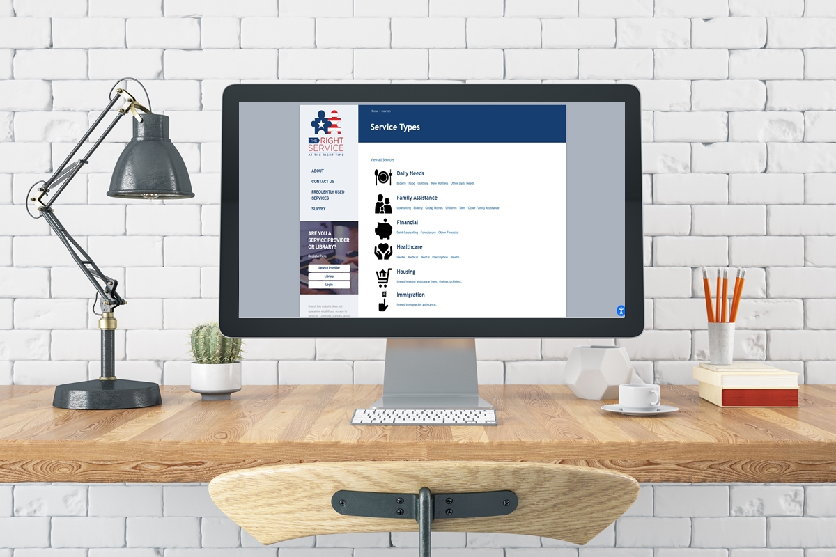 A desktop displays the homepage of “The Right Service at the Right Time,” Marion County’s new online directory for local assistance programs.