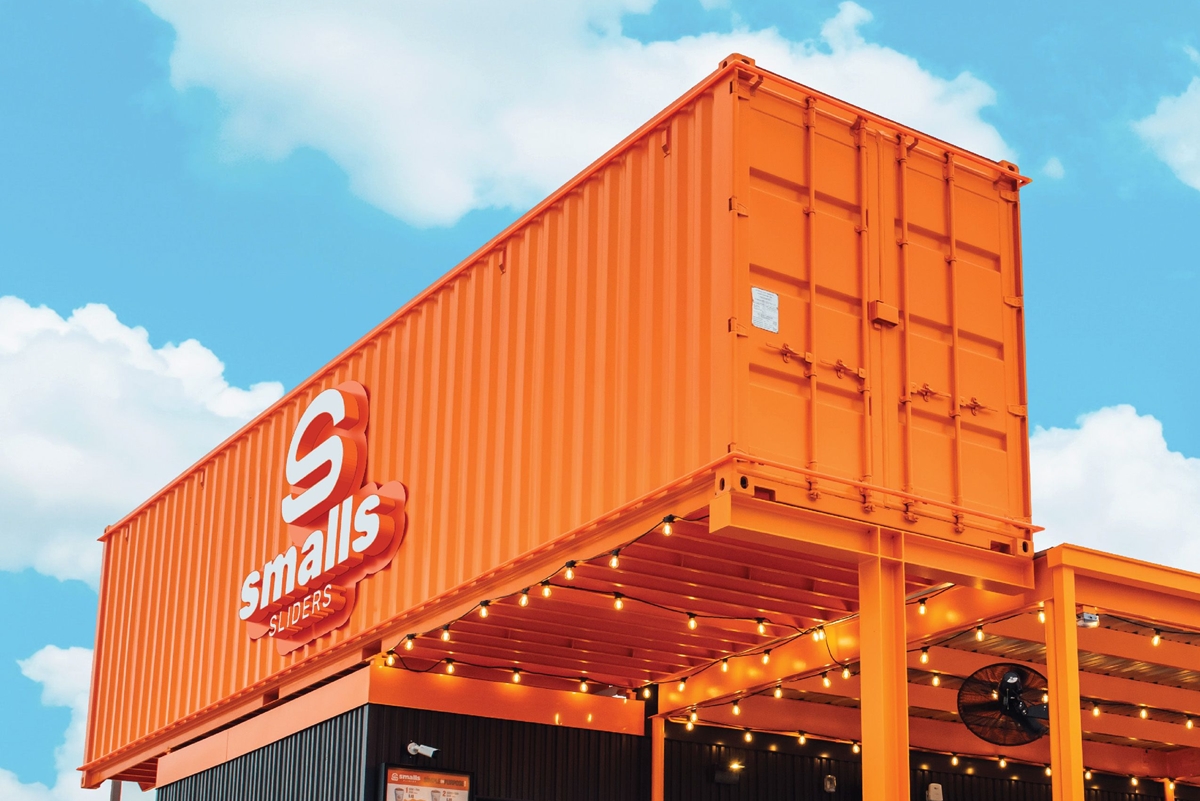 A bright-orange shipping container marks the signature look of Smalls Sliders, set to open its second Ocala location on April 29, 2025.