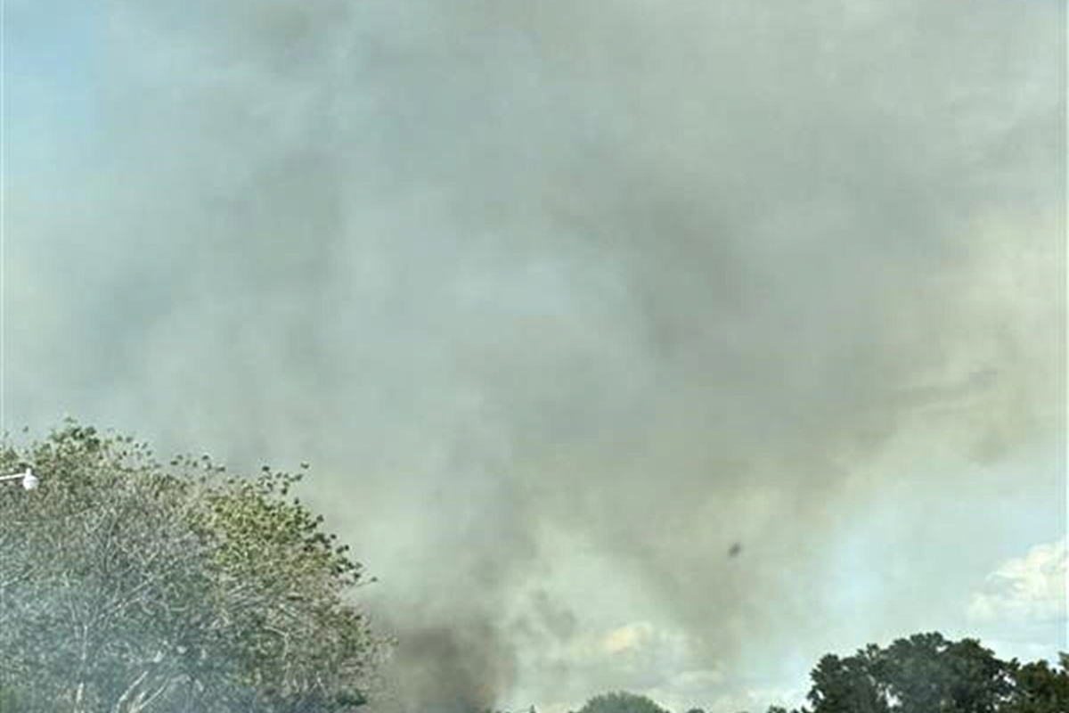 Smoke rises from a field fire behind Walmart on Easy Street earlier this month, as dry and windy weather heightens wildfire concerns across Marion County.