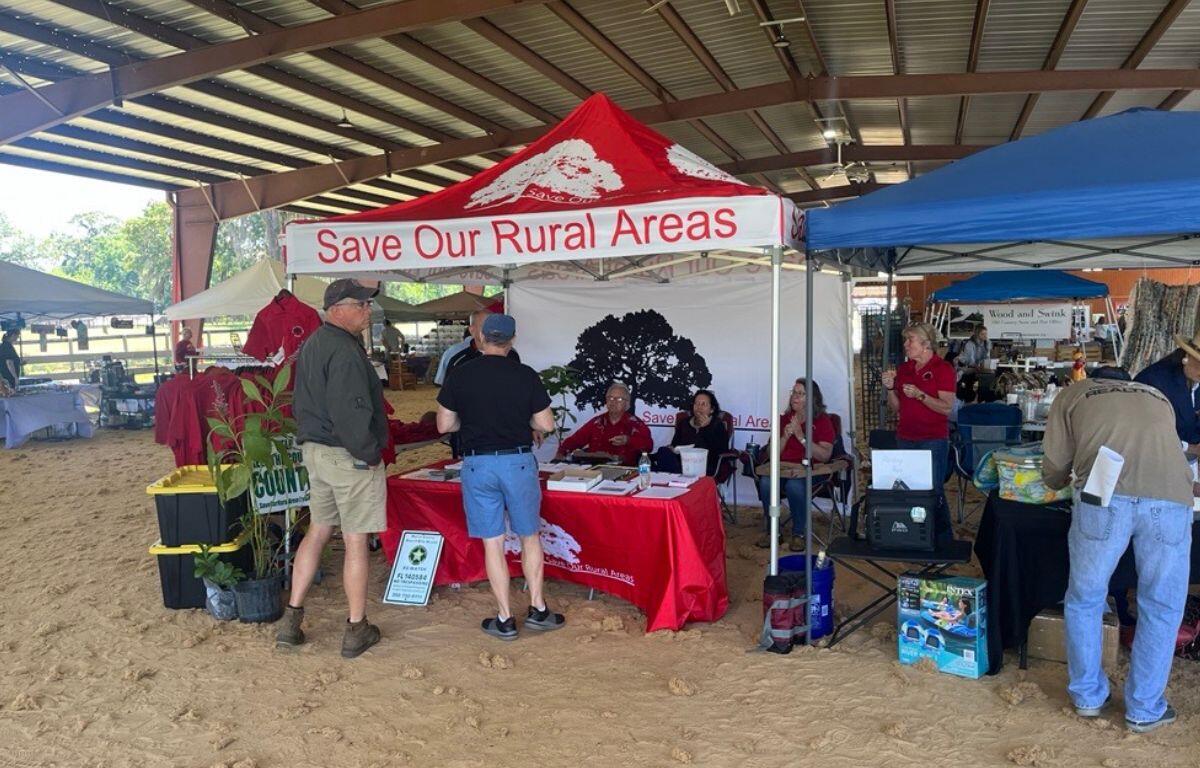 Visitors stop by the Save Our Rural Areas booth during the Marion County Farmland Preservation Festival at Stirrups and Strides on April 12.