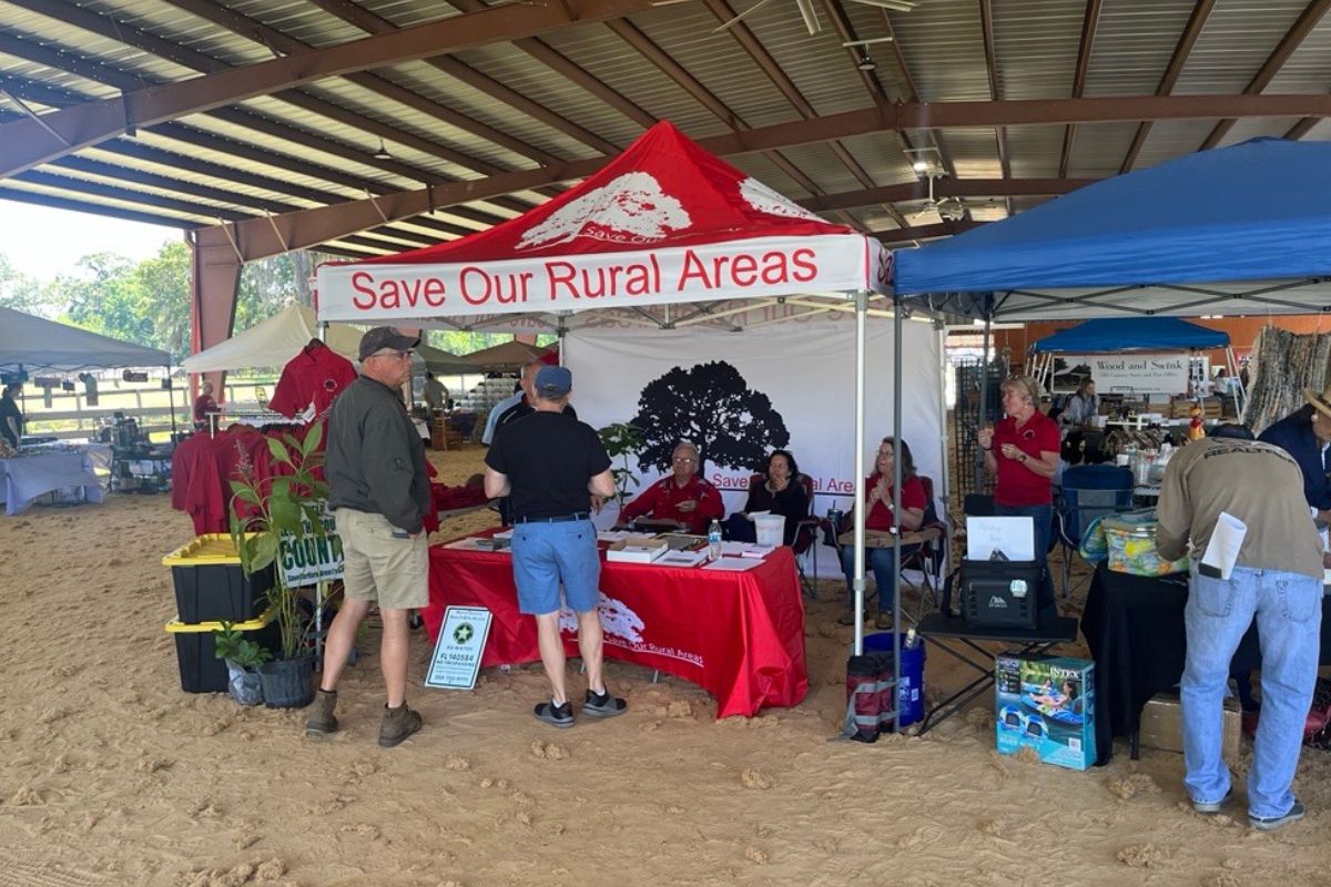 Visitors stop by the Save Our Rural Areas booth during the Marion County Farmland Preservation Festival at Stirrups and Strides on April 12.