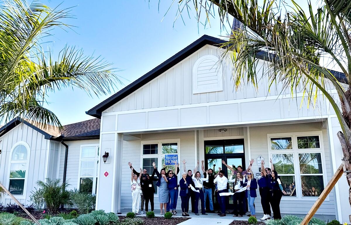 Members of the Ocala Metro Chamber & Economic Partnership cut the ribbon to celebrate the grand opening of Spires 27 Apartments. Courtesy: Ocala Metro Chamber & Economic Partnership