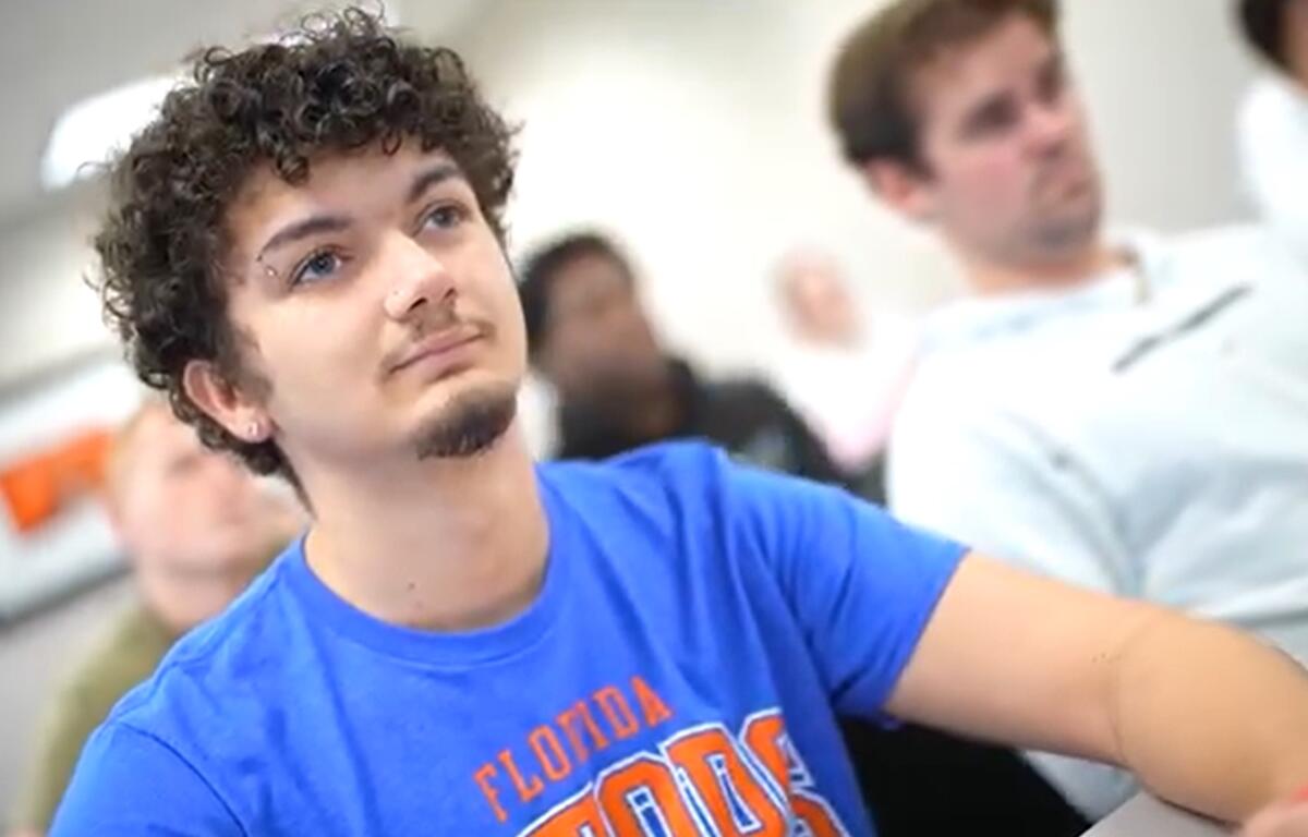 A College of Central Florida student wears a University of Florida T-shirt while attending class in Ocala, Fla., reflecting the new “Going Gator” transfer partnership between CF and UF.